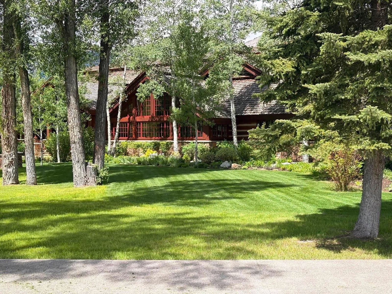 Finished lawn and planting beds at a log home in Jackson, Wyoming
