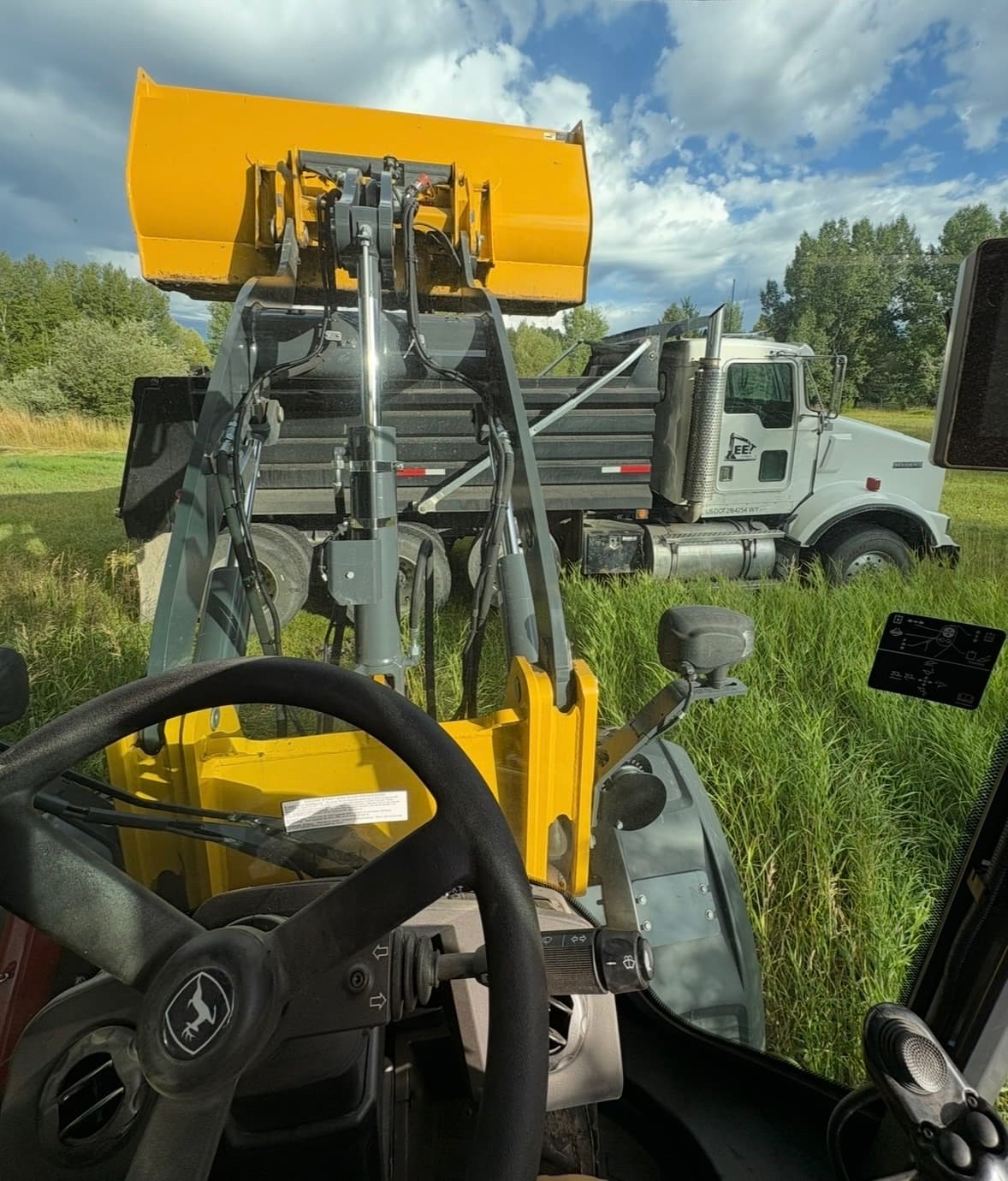 View from the loader cab of a Stradley Landscape dump truck on a Jackson job site